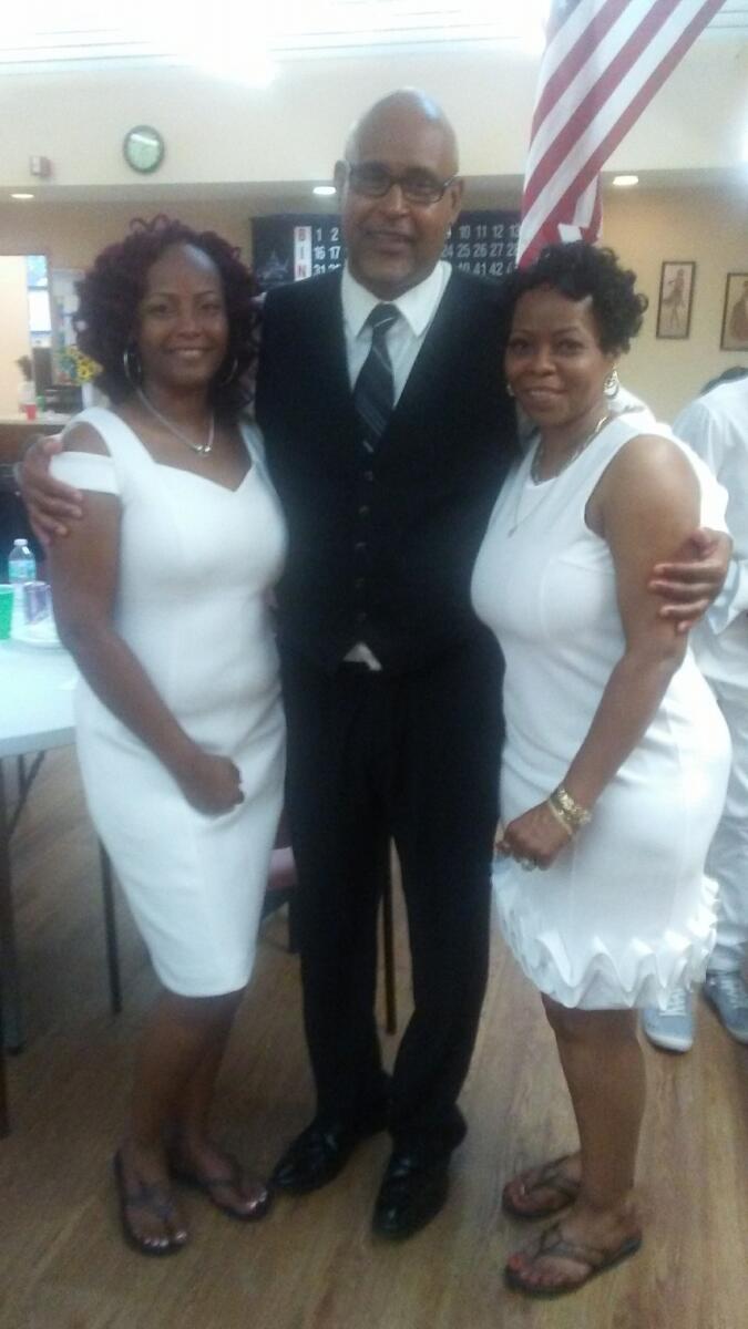 Dexter Scott with sisters Katrice and Katrina.